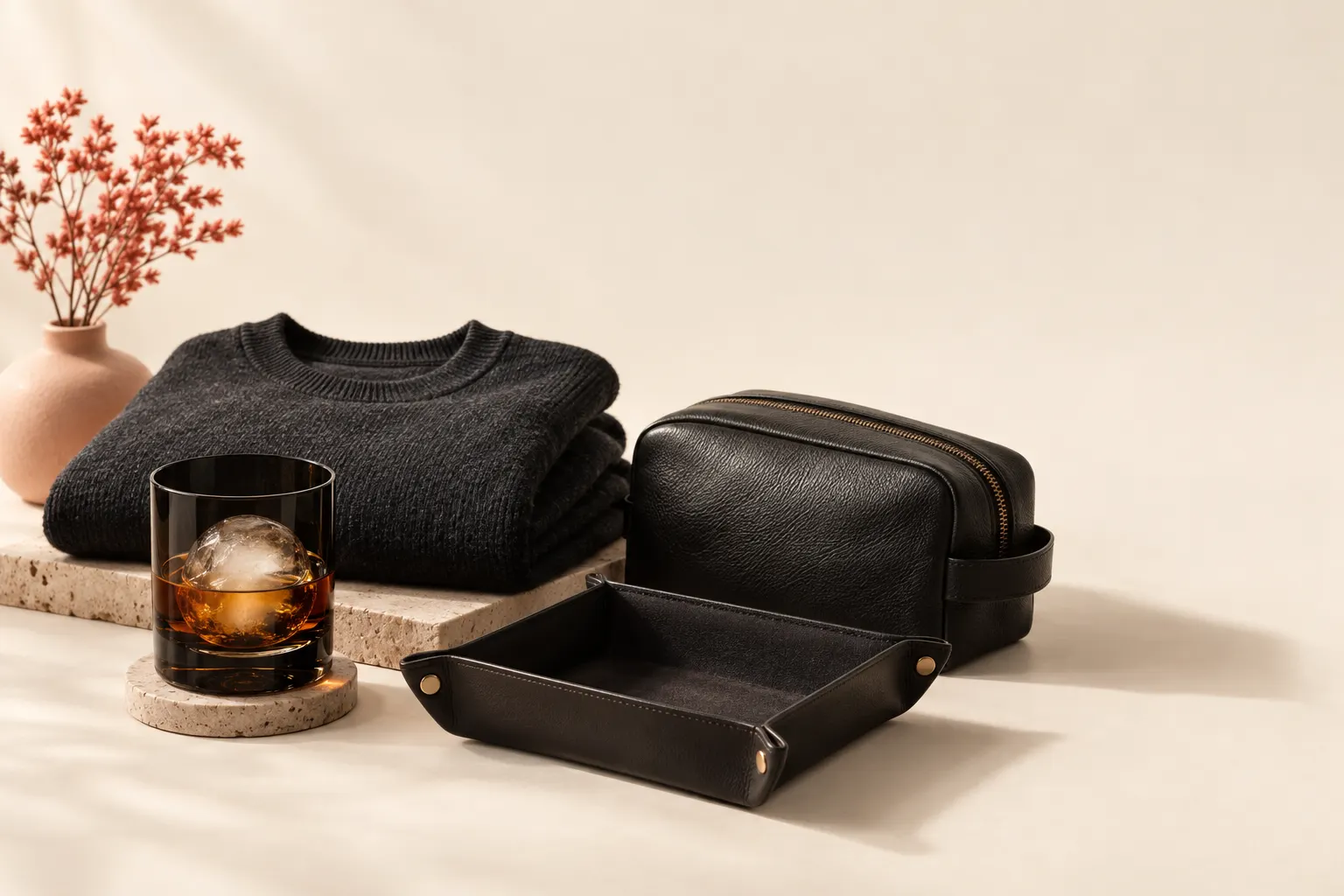 A simple flat illustration of a gift box with headphones, a mug, a game, tools, and travel items.